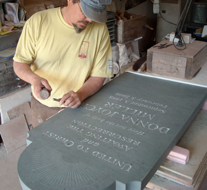 Michael lettering in his shop