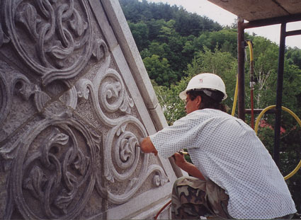 Michael making some finishing touches on a replacement  piece at the Woodstock Library